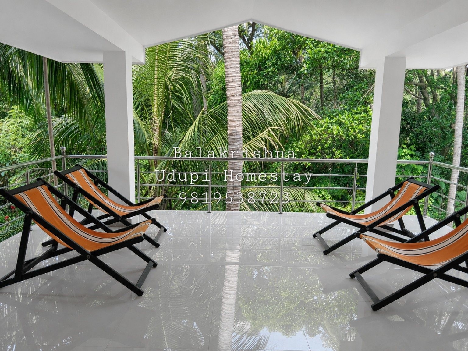 Open balcony with green view at Balakrishna Udupi Homestay